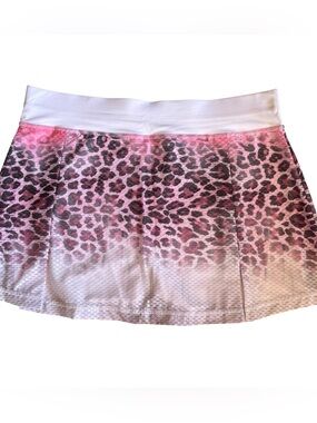 Women's Sofibella skort in pink and gray leopard design for active sports.